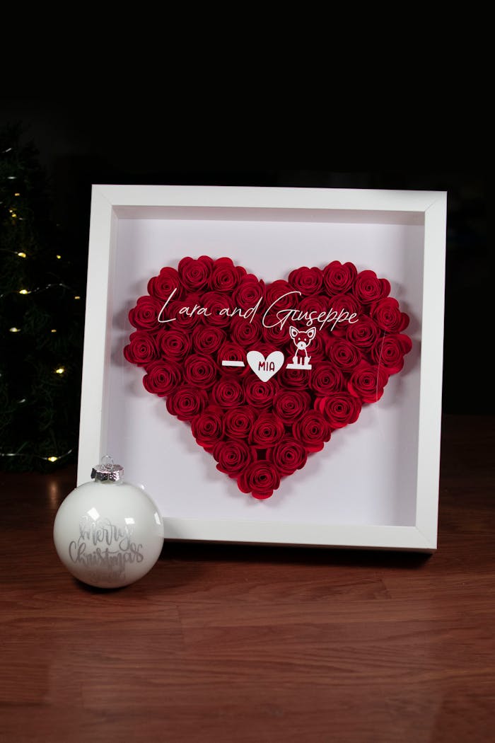 gallery-4 Elegant heart-shaped red rose display in a frame with personal text, ideal for romantic settings.